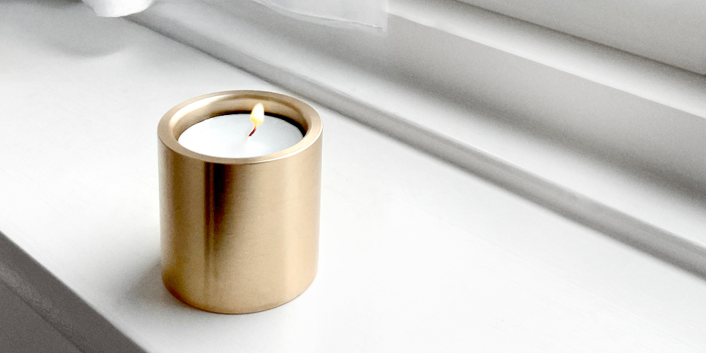 Lysestage i messing, rustfrit stål og sort